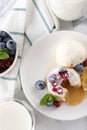 Tasty vanilla fondant with white chocolate, berries and ice cream served on white table, flat lay Royalty Free Stock Photo