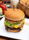 Tasty vegetarian cheeseburgers with round patties or burgers made from grains, vegetables and legumes