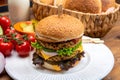 Tasty vegetarian cheeseburgers with round patties or burgers made from grains, vegetables and legumes
