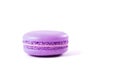 Tasty violet macaron on white.