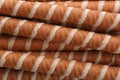 Tasty wafer roll sticks as background, top view. Royalty Free Stock Photo