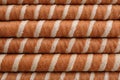 Tasty wafer roll sticks as background, top view. Royalty Free Stock Photo