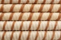 Tasty wafer roll sticks as background, top view. Royalty Free Stock Photo