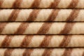 Tasty wafer roll sticks as background, top view. Royalty Free Stock Photo