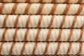 Tasty wafer roll sticks as background, top view. Royalty Free Stock Photo