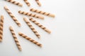 Tasty wafer roll sticks on white background, top view. Royalty Free Stock Photo