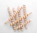 Tasty wafer roll sticks on white background, top view. Royalty Free Stock Photo