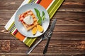 Tasty waffle with ice cream and fruits on plate Royalty Free Stock Photo