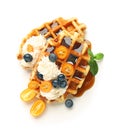 Tasty waffles with fruit, berries and cream on white background Royalty Free Stock Photo