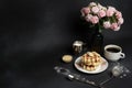 Tasty Waffles Plate, Caramel Sauce, Coffee Cup, Milk, dessertspoon, strainer, pink flowers Royalty Free Stock Photo