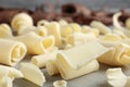 Tasty white chocolate curls on table Royalty Free Stock Photo