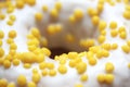 Tasty white donut with yellow round sprinkles. Background, texture. Close up. Macro Royalty Free Stock Photo