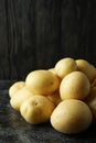 Tasty young potato on black smokey table