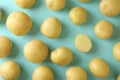 Tasty young potato on blue background, top view