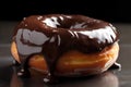 Tasty yummy chocolate doughnut on dark blurred background