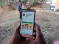 tata cliq online shopping app displayed on smart phone screen at agriculture field in india dec 2019