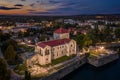 Tata, Hungary - Aerial view of the beautiful illuminated Castle of Tata by the Old Lake Ãâreg-to at dusk with colorful clouds