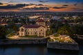 Tata, Hungary - Aerial view of the beautiful illuminated Castle of Tata by the Old Lake Ãâreg-to at dusk with colorful sunset Royalty Free Stock Photo