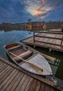 Tata, Hungary - Fishing boat by Lake Derito Derito to with wooden fishing cottages Royalty Free Stock Photo