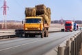 Tatarstan, Russia, Interstate Highway M7  - Apr 14th 2021. Truck KAMAZ with sheaves of hay move along the federal highway to their Royalty Free Stock Photo