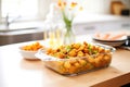 tater tot casserole in a glass baking dish