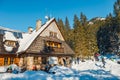 Group of tourists sit in front of a mountain hut and enjoy the sun, Koscieliska Valley Royalty Free Stock Photo