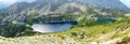 Tatra mountains in Poland, green hill, lake and rocky peak in the sunny day with clear blue sky