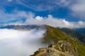 Tatra Mountains ridge surrounded by the sea of the clouds Royalty Free Stock Photo