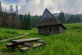 Tatra National Park in Poland. Poland, sitting in nature, wooden benches, grren meadow and cottage