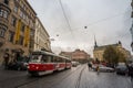 Tatra tram from the Brno public transportation on by the namesti svobody square in the city center during a rainy afternoon