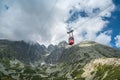 TATRANSKA LOMNICA, SLOVAKIA, AUGUST 2020 - Red cabin of cableway from Skalnate pleso to peak Lomnicky Stit in High Royalty Free Stock Photo