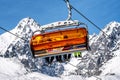 Ski lift and peak Lomnicky stit in High Tatras mountains in resort Tatranska Lomnica, Slovakia Royalty Free Stock Photo