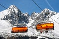 Ski lift and peak Lomnicky stit in High Tatras mountains in resort Tatranska Lomnica, Slovakia Royalty Free Stock Photo