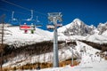 Skiers sitting at ski-lift chairs in resort Tatranska Lomnica, Slovakia Royalty Free Stock Photo