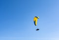 Paragliding - The pilot lies supine in a coccoon-like - speed bag - suspended below a fabric wing Royalty Free Stock Photo