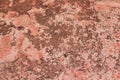 Tatter of a multi-colored old paint on a surface of a stone wall Royalty Free Stock Photo