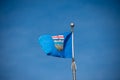 Alberta flag against blue sky
