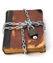 Tattered book with chain and padlock Royalty Free Stock Photo