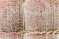 Tattered sackcloth background. Old burlap with hole. Royalty Free Stock Photo