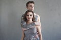 Tattoed stylish guy hugging his beautiful girlfriend Royalty Free Stock Photo