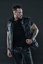 Tattoo art concept. Macho unshaven brutal wear vest. Man brutal unshaven hispanic appearance tattooed arms. Bearded man Royalty Free Stock Photo