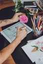 Tattoo art digital process on ipad. Tattoo artist hands holding Apple Pencil and drawing on iPad Pro in Procreate. Kropivnitskiy,