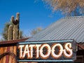 Tattoo emporium in the desert, street sign Royalty Free Stock Photo