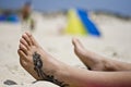 Tattoo foot in the sand Royalty Free Stock Photo