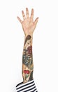 The tattoo hand raised on white background