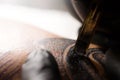 Tattoo needles on human skin. Close up Royalty Free Stock Photo