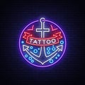 Tattoo salon logo in a neon style. Neon sign, emblem, anchor symbol with a ribbon, luminous billboard, neon advertising