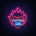 Tattoo salon logo vector. Neon sign, a symbol of heart in the fire, a bright luminous billboard, a night banner, neon Royalty Free Stock Photo