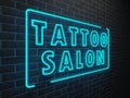 TATTOO SALON neon light sign on brick wall Royalty Free Stock Photo