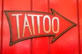 Tattoo sign with large arrow Royalty Free Stock Photo